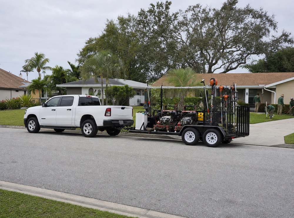 Jack Coniam truck and equipment trailer parked outside a customer's home in North Pinellas County.